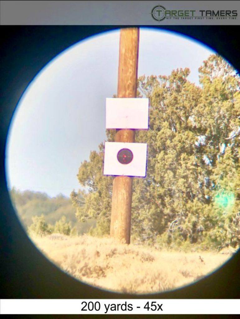 Photo of bullet groupings at 200 yards taken through Carson spotter at 45x