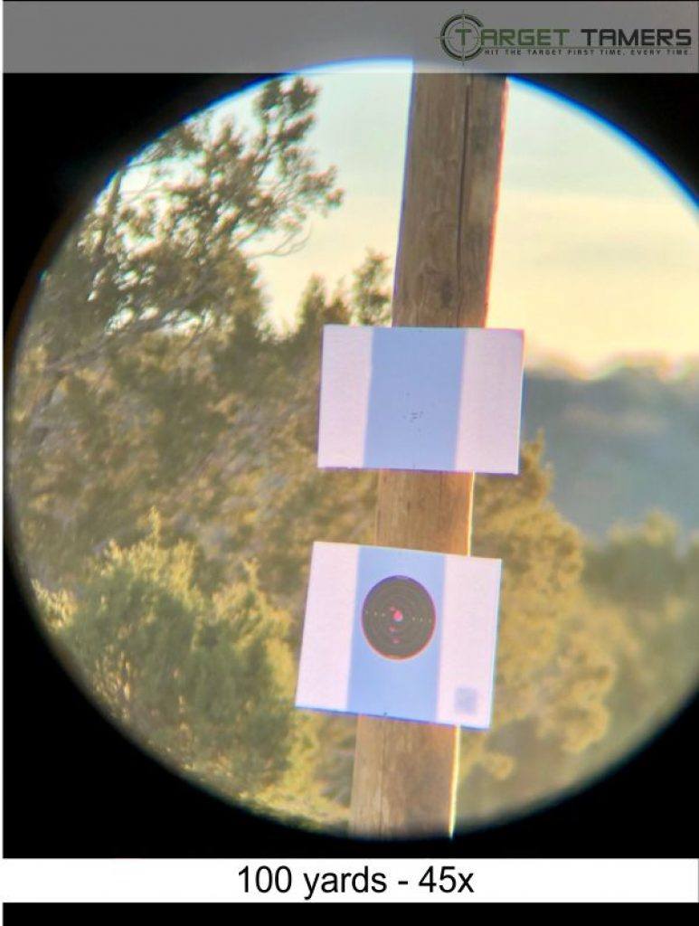 Photo of bullet groupings at 100 yards taken through Everglade spotter at 45x