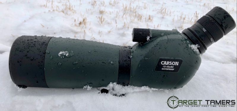 Carson spotting scope sitting in a snow drift