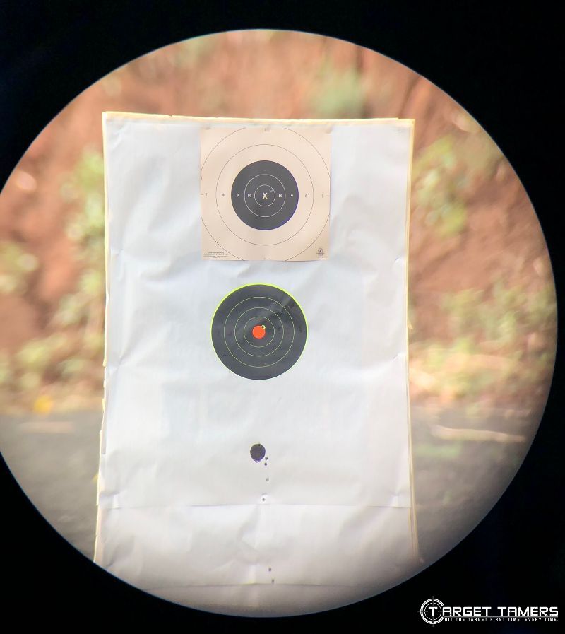 Bullet holes on target at 100 Yards