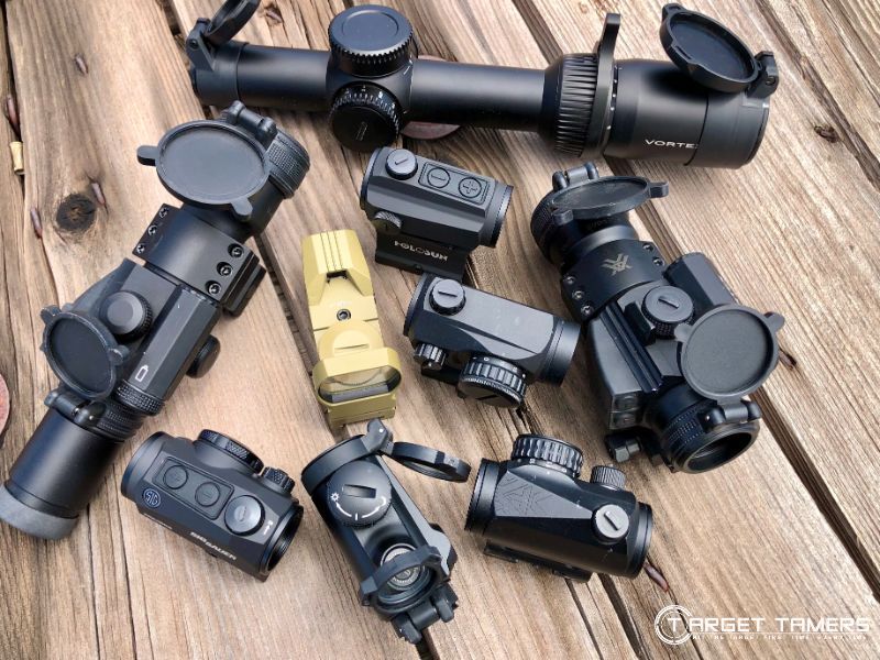 An assortment of red dot sights and LPVO's