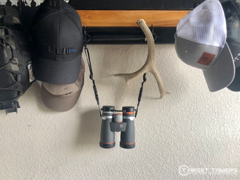 Binoculars hanging on rack inside dry room