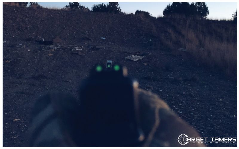 Tritium sights on pistol in action