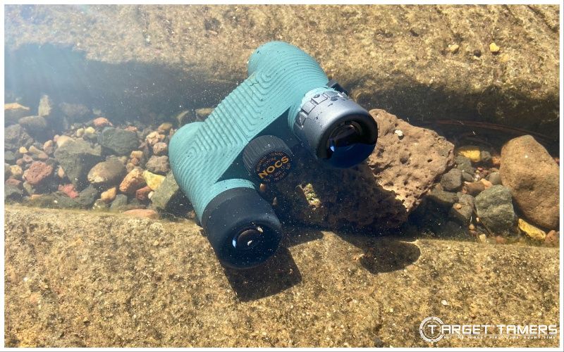 Nocs 8x25 binoculars submerged in lake water